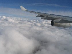 Iberia airbus A3?? wing and  clouds over atlantic ocean on way to Gran Canaria