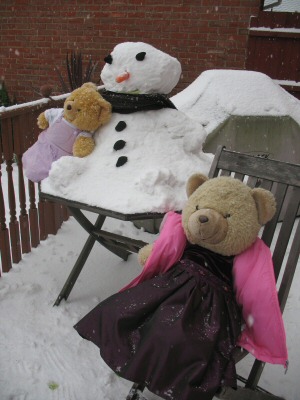 Sophie and Sarah Bear with their snowman in January 2009.