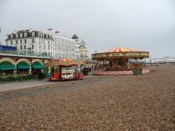 Sarah Bear watching & the carousel on brighton beach